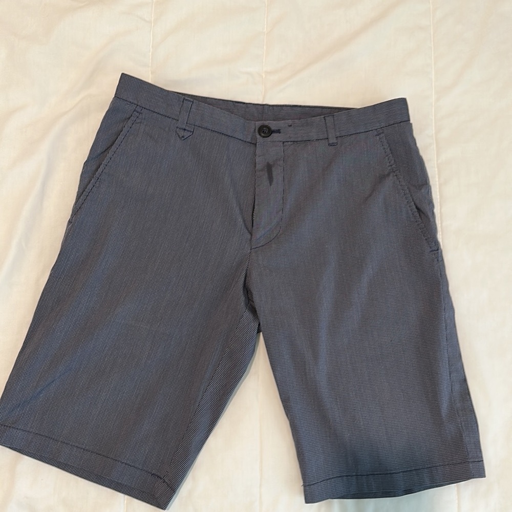 Hugo Boss flat front 9 1/2 inch length dress shorts from the RED collection.